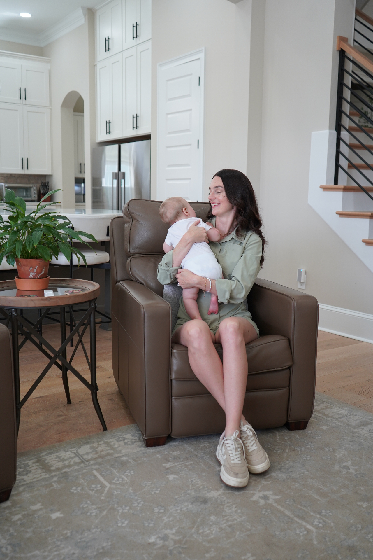 Founder holding her baby at home